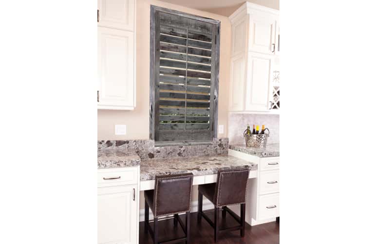 Kitchen window with reclaimed wood shutters in Dallas